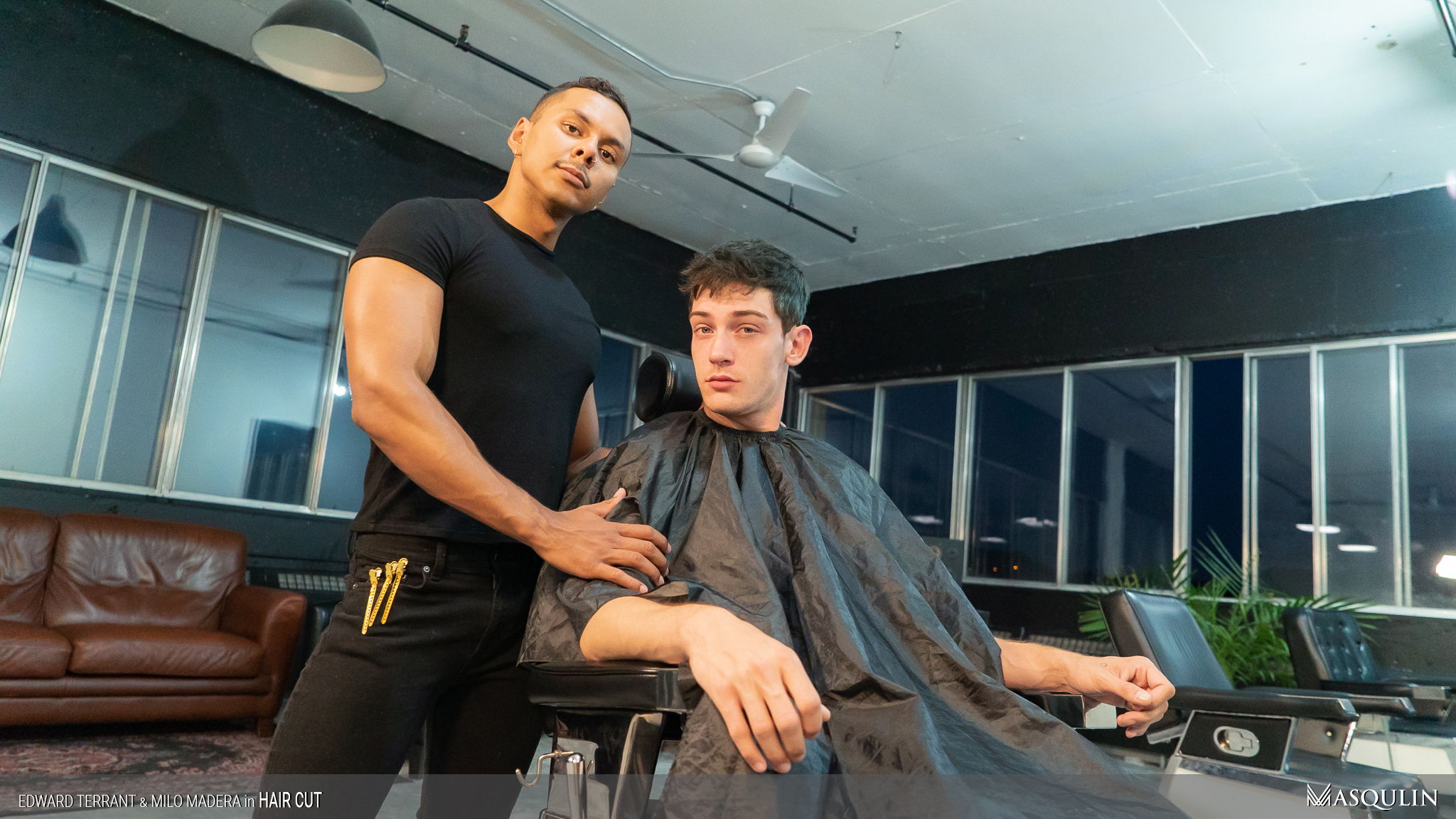 Guy feeling barber's dick while getting a haircut